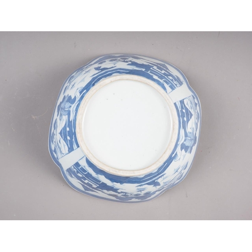 121 - A Chinese blue and white shaped rim bowl with panelled landscape decoration, 9 1/2