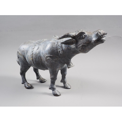 129 - A patinated brass model of a water buffalo, 8