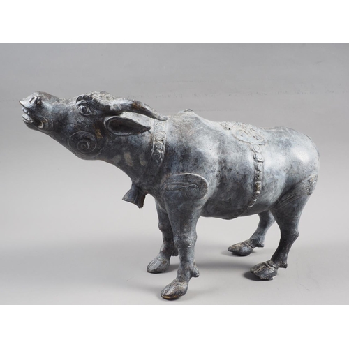 129 - A patinated brass model of a water buffalo, 8