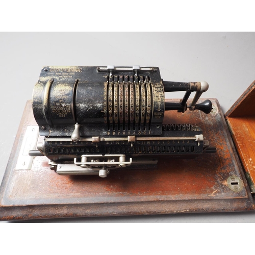 148 - A Britannic calculating machine, in box, serial number 6095