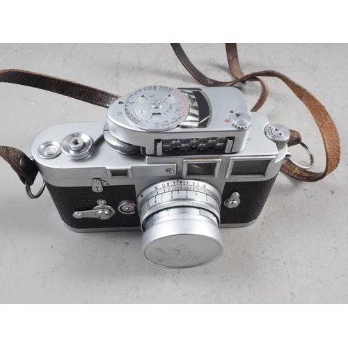 154 - A Leica M3 camera number 837 828  with Summicron f=5cm 1.2 lens, light meter and two filters, in box