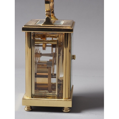 165 - A David Peterson brass cased carriage clock with Swiss movement, white enamel dial and Roman numeral... 