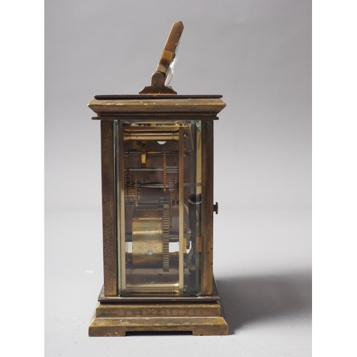 168 - A brass cased carriage clock with white enamel dial and Roman numerals