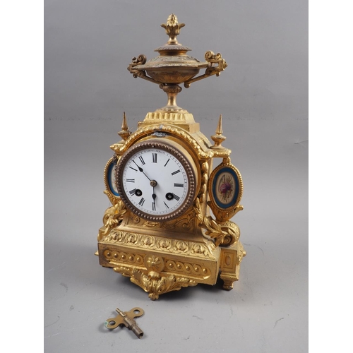 170 - A slate mantle clock of architectural form, a similar onyx mantel clock and a gilt cased mantle cloc... 