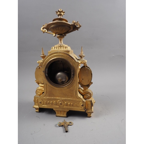 170 - A slate mantle clock of architectural form, a similar onyx mantel clock and a gilt cased mantle cloc... 