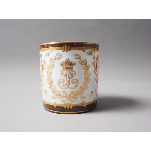 19 - A Sevres style cabinet cup with cherub and monogram decoration on a brown ground, a similar saucer w... 