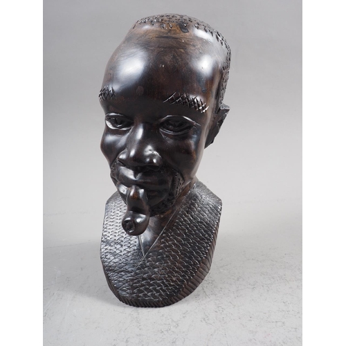 218 - A carved ebony head of a man, 9