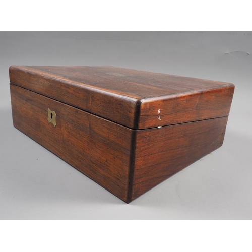 221 - A Victorian rosewood and brass mounted writing box with brown and gilt tooled leather interior, 13