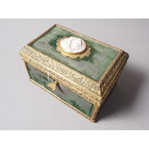 223 - A green velvet and brass casket, lid mounted with carved shell cameo, 7