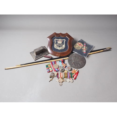 250 - A quantity of mostly WWII medals, two swagger sticks, a death plaque and other items