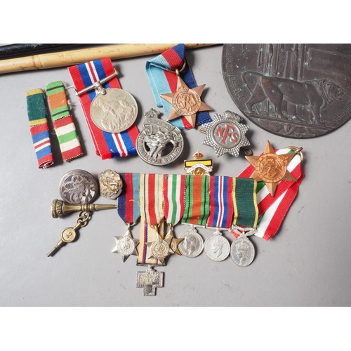 250 - A quantity of mostly WWII medals, two swagger sticks, a death plaque and other items