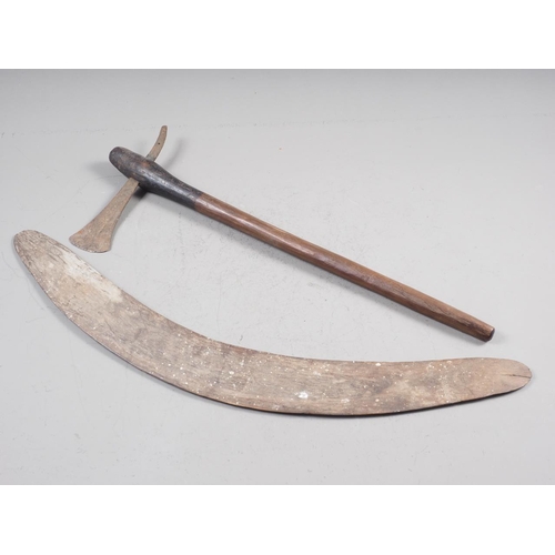 252 - An early Aboriginal stone carved boomerang, 25