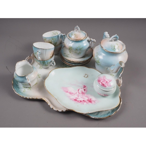 49 - A late 19th century Continental porcelain floral decorated afternoon teaset for four with tray, a do... 