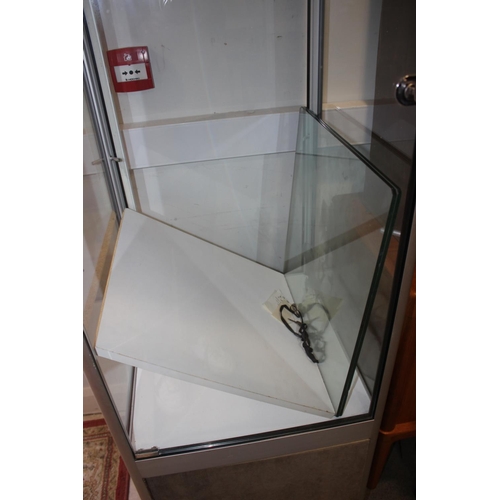 608 - A contemporary aluminium glass display cabinet fitted two glass shelves over cupboard enclosed one d... 