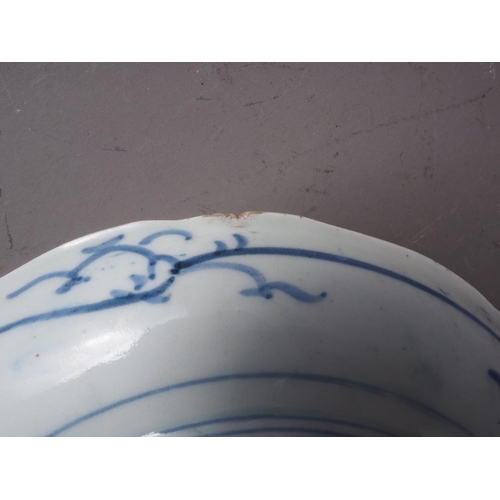 85 - A Japanese blue and white dish with sectioned floral bordered decoration and six-character mark to b... 