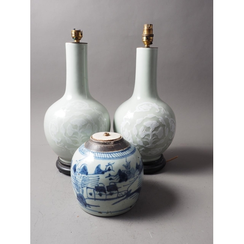 88 - A pair of Chinese celadon glazed vases with dragon, flower and cloud decoration, on hardwood bases, ... 