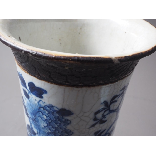 93 - A Chinese blue, white and unglazed cylindrical flared rim crackle glaze vase with bird and tree deco... 