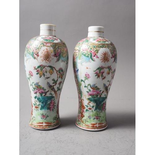 96 - A pair of Canton enamelled baluster vases, decorated panels with birds, figures and flowers, 8 1/2