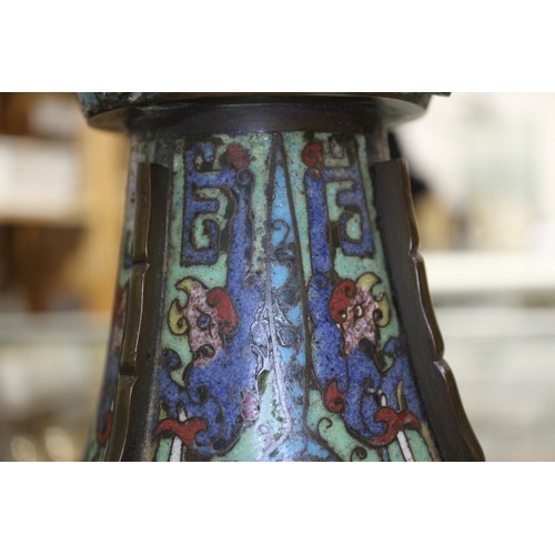 136 - An antique Chinese cloisonne gu vase with all-over scroll and mask design, 14