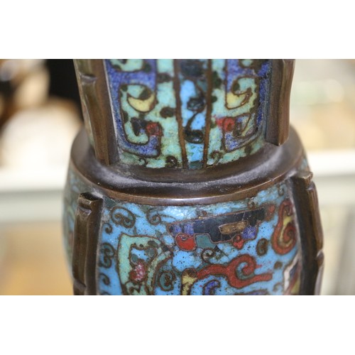 136 - An antique Chinese cloisonne gu vase with all-over scroll and mask design, 14