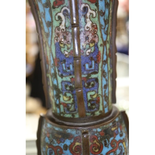 136 - An antique Chinese cloisonne gu vase with all-over scroll and mask design, 14