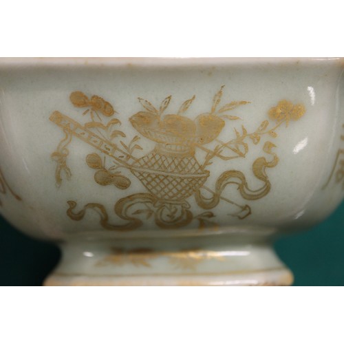 114 - A Chinese celadon glazed octagonal bowl with gilt decoration and gilt seal mark to base, on hardwood... 