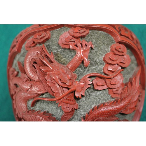 135 - A Chinese cinnabar lacquered wall pocket, formed as a vase with dragon and flower decoration, 9