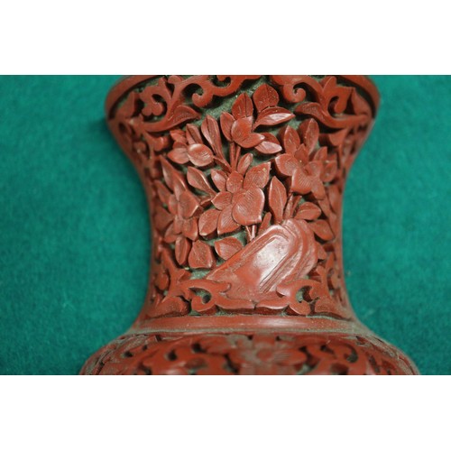 135 - A Chinese cinnabar lacquered wall pocket, formed as a vase with dragon and flower decoration, 9