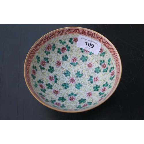 109 - A Chinese famille rose bowl, decorated four circular panels with precious objects and flowers on a y... 