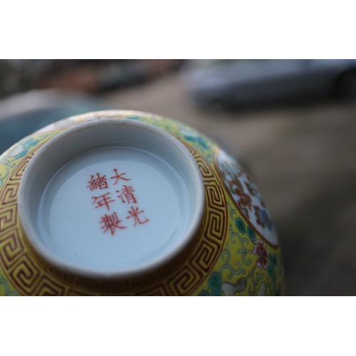 109 - A Chinese famille rose bowl, decorated four circular panels with precious objects and flowers on a y... 