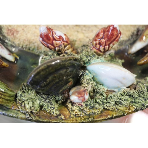 9 - A Palissy style wall plate with relief crab and crustacean decoration, 12 1/4