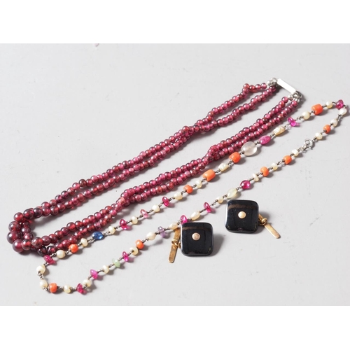 329 - A two-strand graduated garnet bead necklace, a garnet coral and blister pearl necklace and a pair of... 