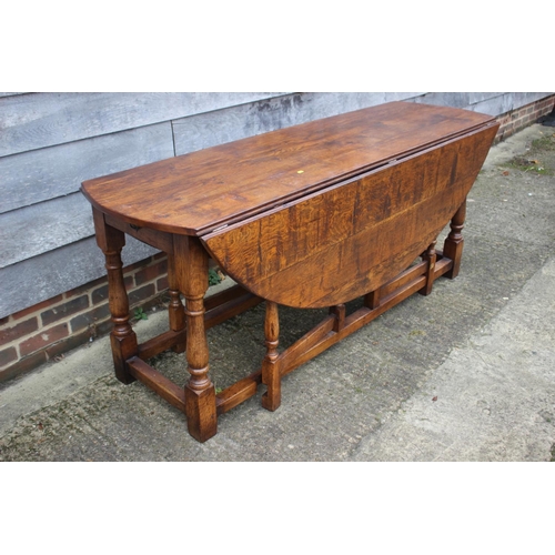 508 - An oak wake table of 17th century design with drop leaves, on turned and stretchered supports, top 7... 