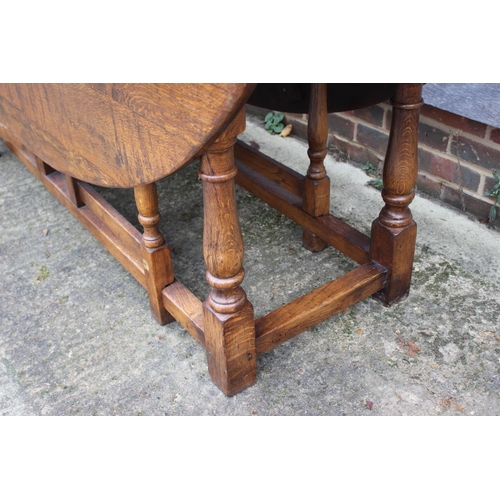 508 - An oak wake table of 17th century design with drop leaves, on turned and stretchered supports, top 7... 