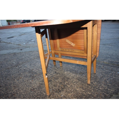 523 - A walnut deep drop leaf dining table, 30