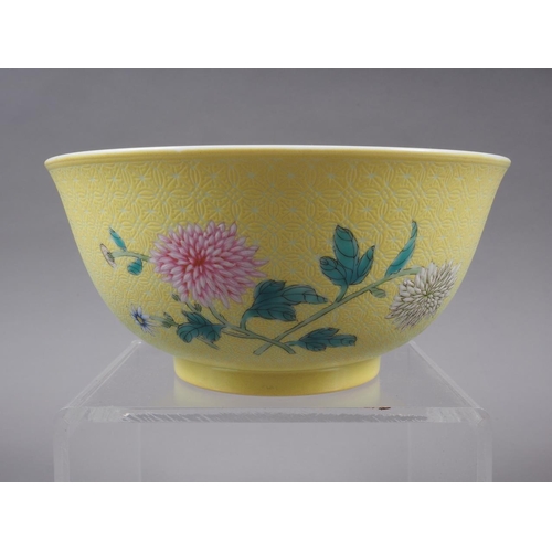 102 - A Chinese porcelain bowl, decorated with sprays on a yellow ground, 6 1/4