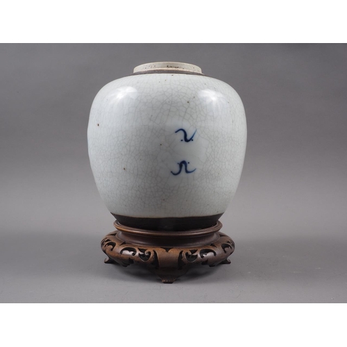 111 - A Chinese blue and white crackle glazed ginger jar with floral decoration, and associated carved har... 