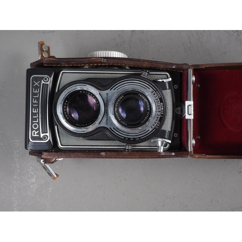 134 - A  Rolleiflex twin lens reflex camera, in leather case