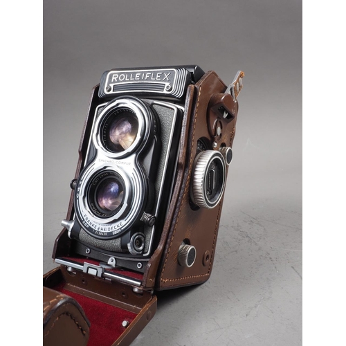 134 - A  Rolleiflex twin lens reflex camera, in leather case