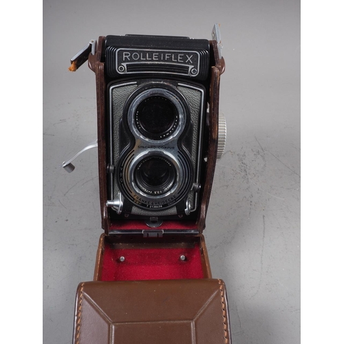 134 - A  Rolleiflex twin lens reflex camera, in leather case