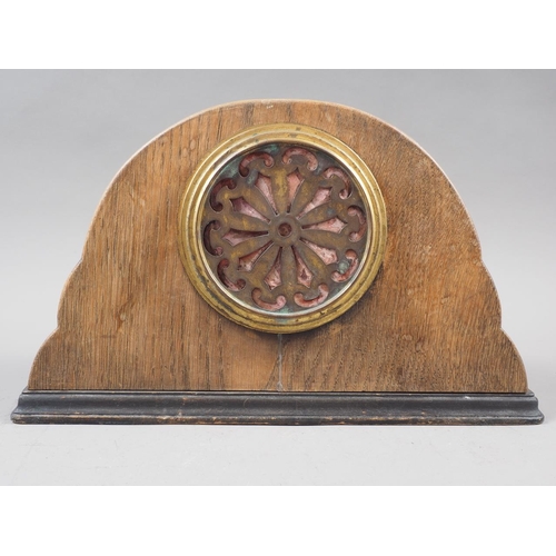 141 - An early 20th century carved oak mantel clock with silvered dial, 7 1/4