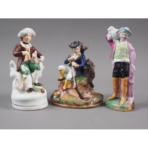 17 - A 19th century Staffordshire bone china figure of a hunter with a rabbit, on rockwork base, 4 1/2