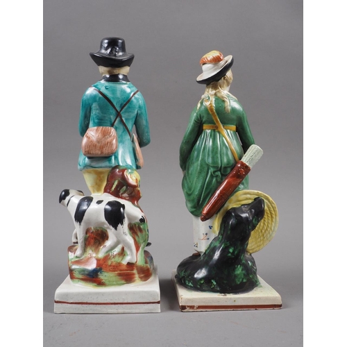 20 - An early 19th century Staffordshire figure of a huntsman with gun dog, 7 1/4