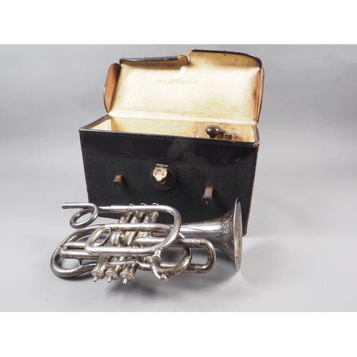 203 - A Victorian silver plated cornet with engraved decoration, in leather travelling case, made by Antoi... 