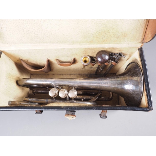 203 - A Victorian silver plated cornet with engraved decoration, in leather travelling case, made by Antoi... 