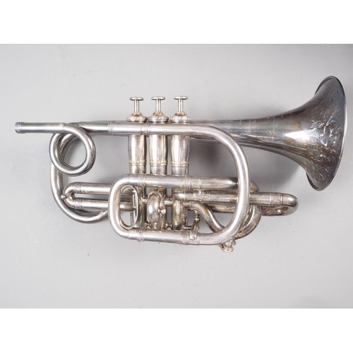 203 - A Victorian silver plated cornet with engraved decoration, in leather travelling case, made by Antoi... 