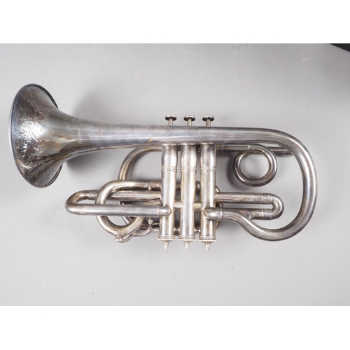 203 - A Victorian silver plated cornet with engraved decoration, in leather travelling case, made by Antoi... 