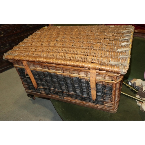 210 - A wicker and leather bound basket, 30 1/2