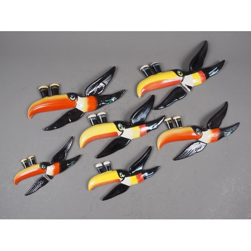 244 - A set of three Carltonware Guinness flying toucan wall plaques, and another set (two toucans with br... 