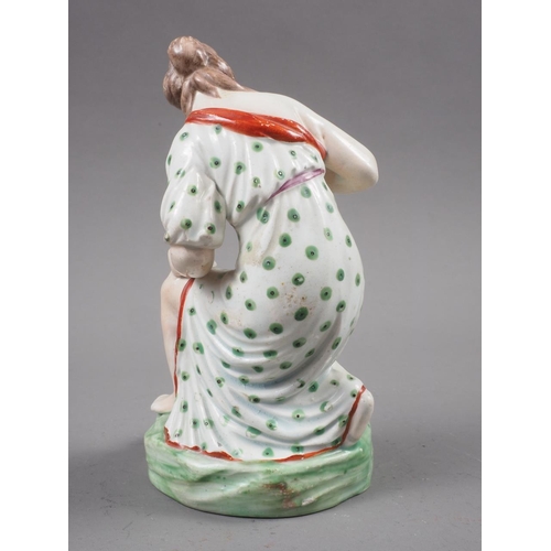 26 - An 18th century Staffordshire polychrome enamel decorated figure of 